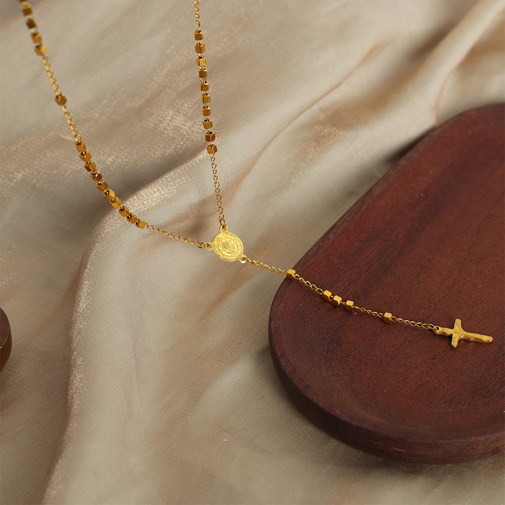 ELLIPTICAL BRAND TASSEL NECKLACE