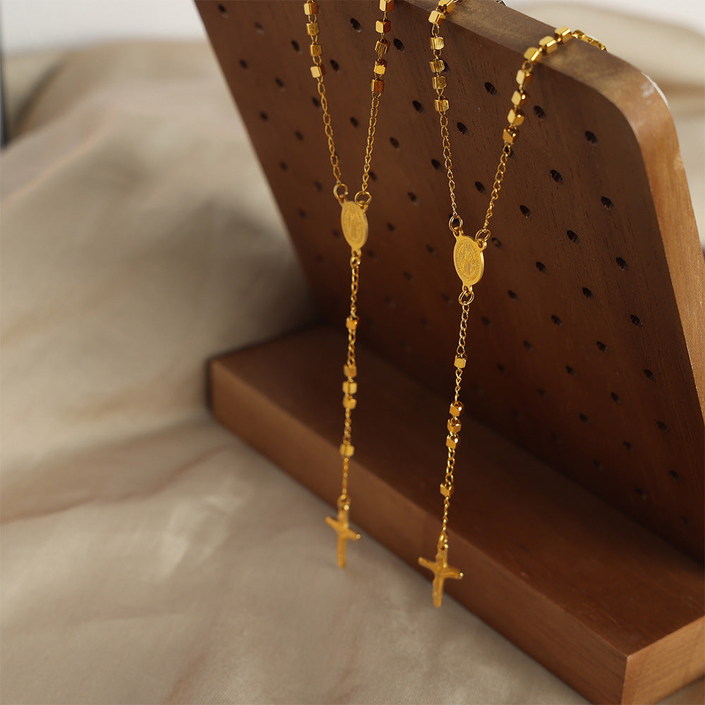 ELLIPTICAL BRAND TASSEL NECKLACE