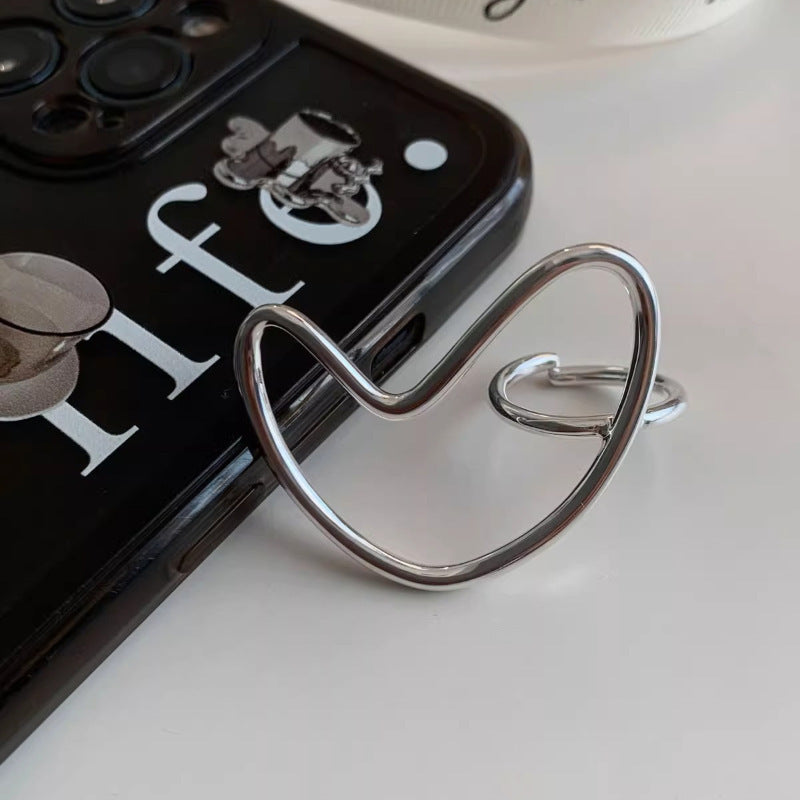 Exaggerated heart-shaped line ring