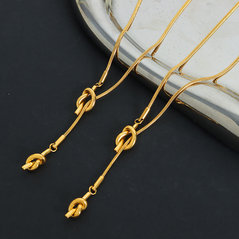 HEART SHAPED KNOTTED TASSEL NECKLACE