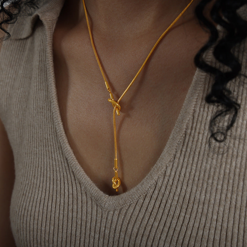 HEART SHAPED KNOTTED TASSEL NECKLACE