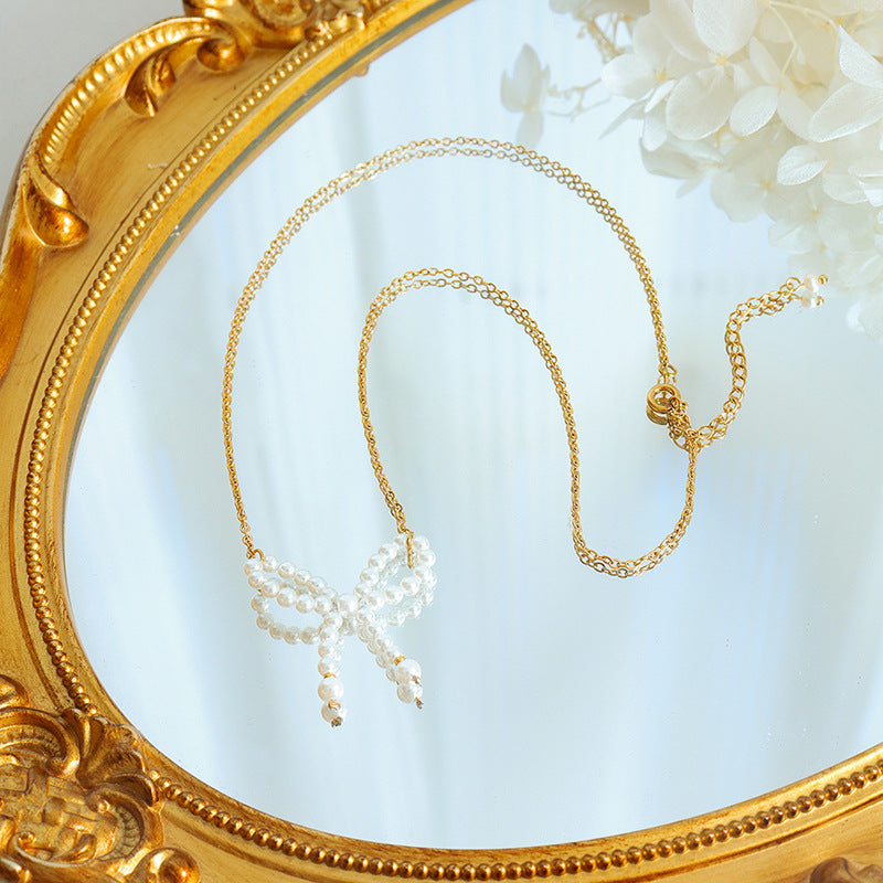 IMITATION PEARL BOW NECKLACE