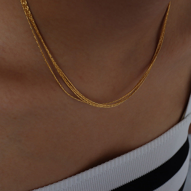 MULTI LAYERED LAYERED NECKLACE