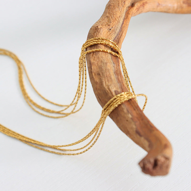 MULTI LAYERED LAYERED NECKLACE