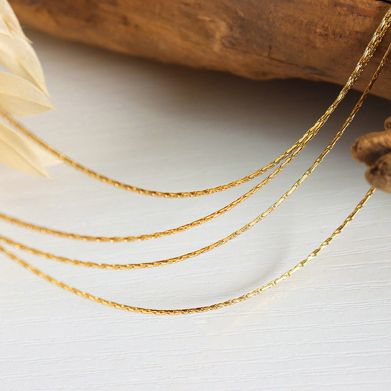 MULTI LAYERED LAYERED NECKLACE