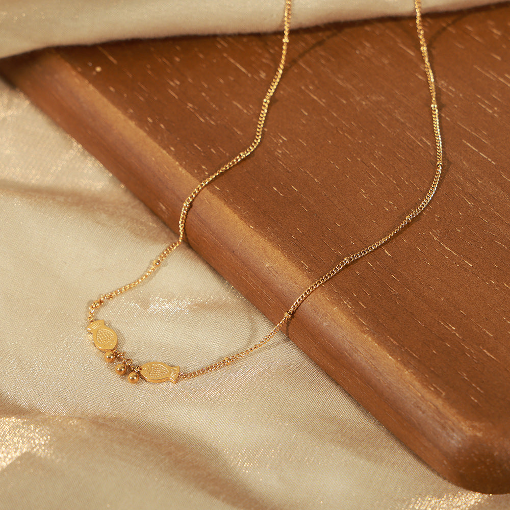 PISCES PLAYING PEARL NECKLACE